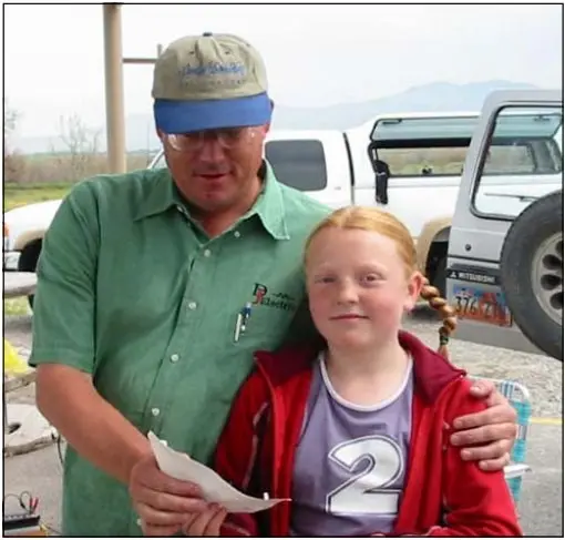 Darrel receives the First Place $15 Gift Certificate from Don’s Granddaughter, Cinimin Kofford.