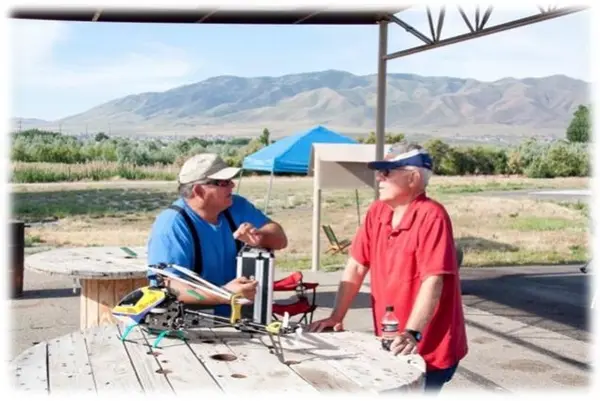 Milt and Pocho discuss the finer points of flying