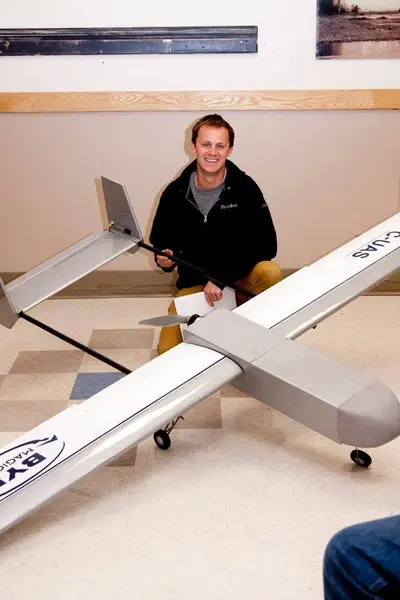 This month's model-of-the-month winner: Brandon Reimschiissel with his own design and BYU-sponsored self-piloted autonomous aircraft. Weighs ~25 lbs with an 8-foot wingspan, and stuffed full of electronics for navigation and visual landmark recognition. This aircraft will be BYU's entry in the C-UAS (Center for Unmanned Aircraft Systems) national competition.